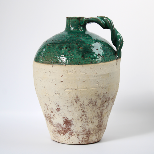 handmade rustic terracotta jug with green glaze