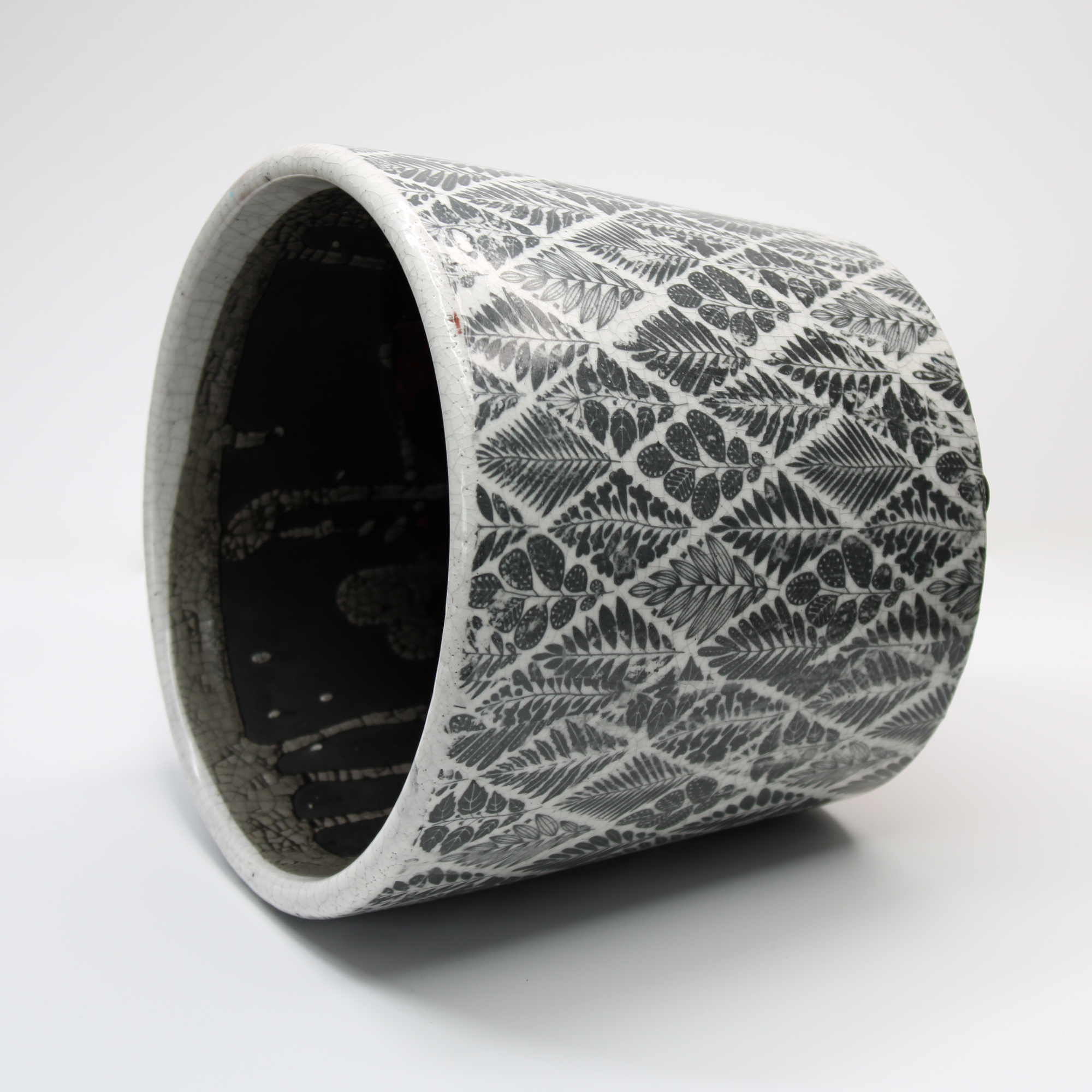 glazed plant pot with a black and white vintage style design