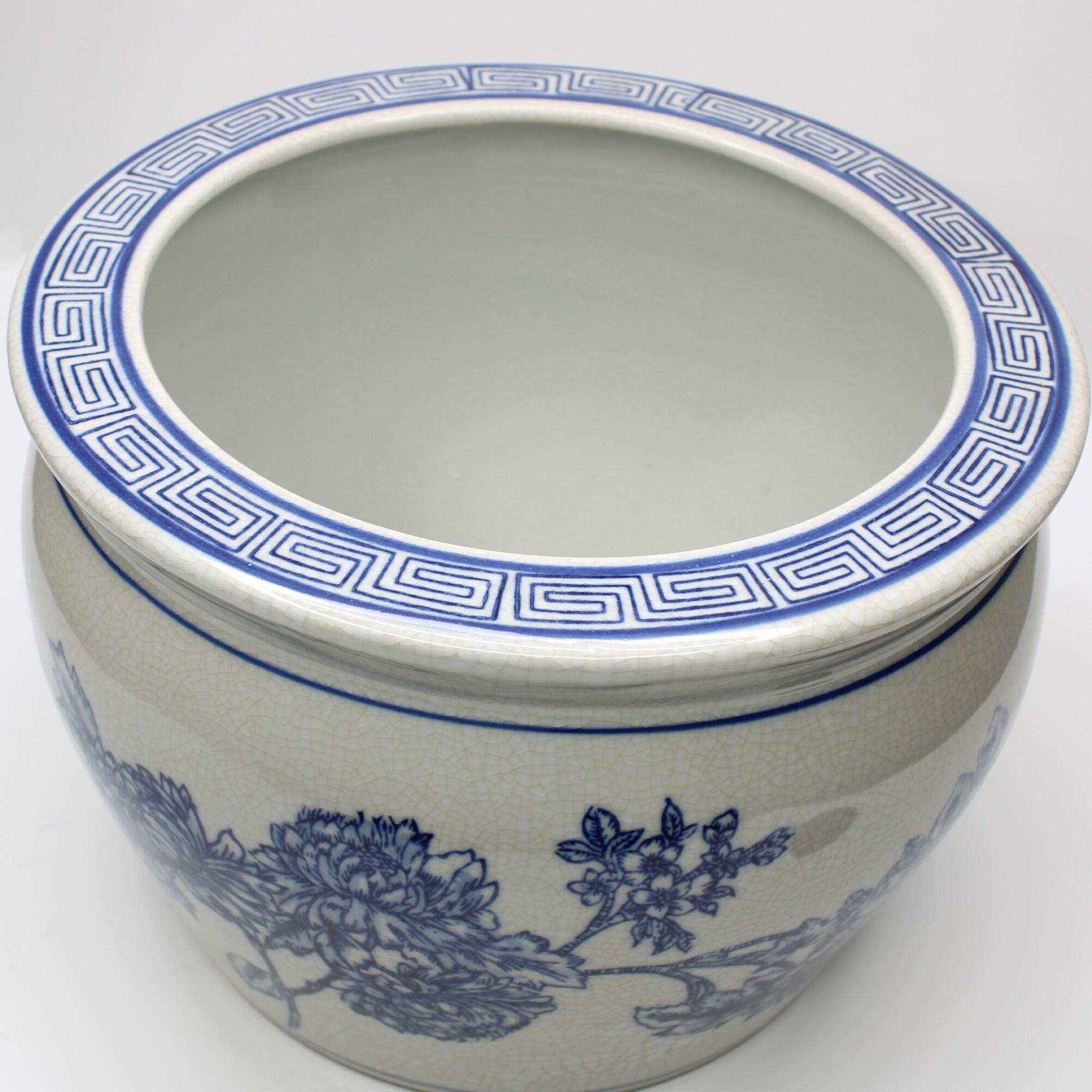 Decorative blue floral pot focusing on the top of the rim.