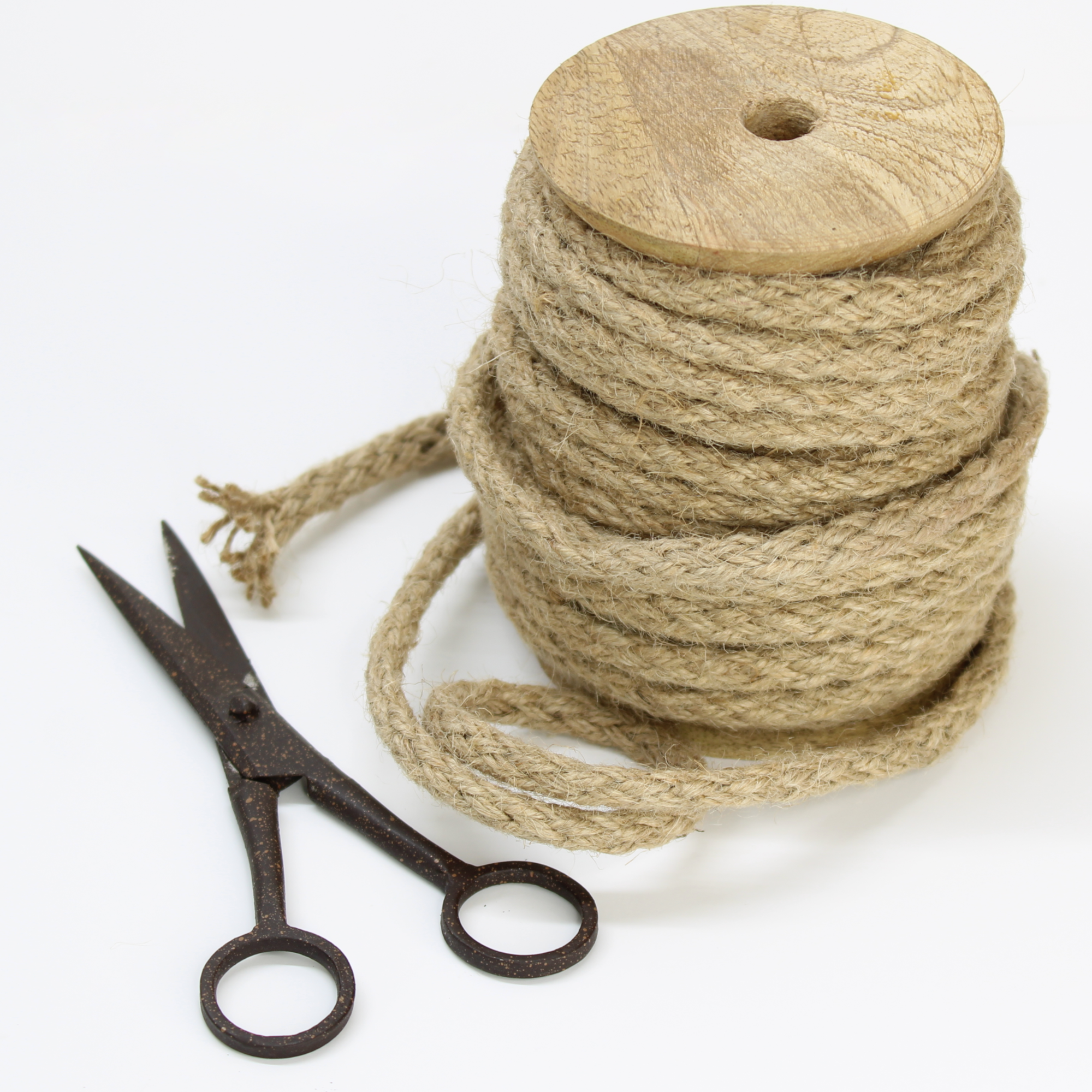 jute twine on wooden stand with scissors for DIY projects