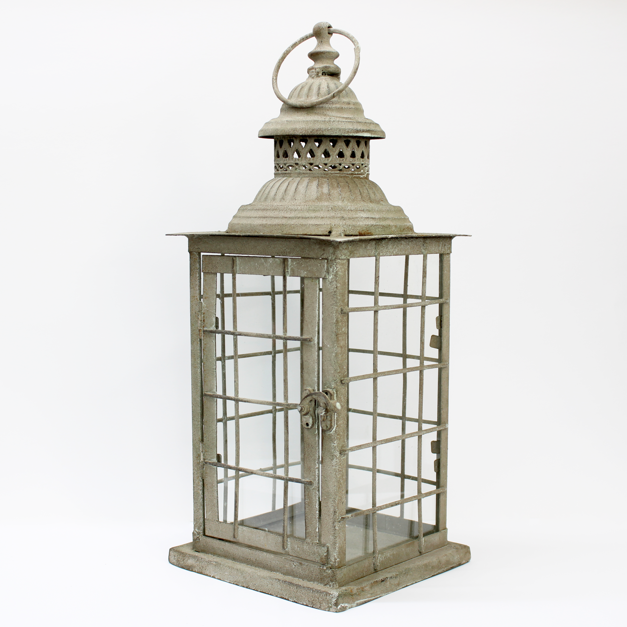 Vintage-style candle lantern crafted from weathered metal and clear glass.