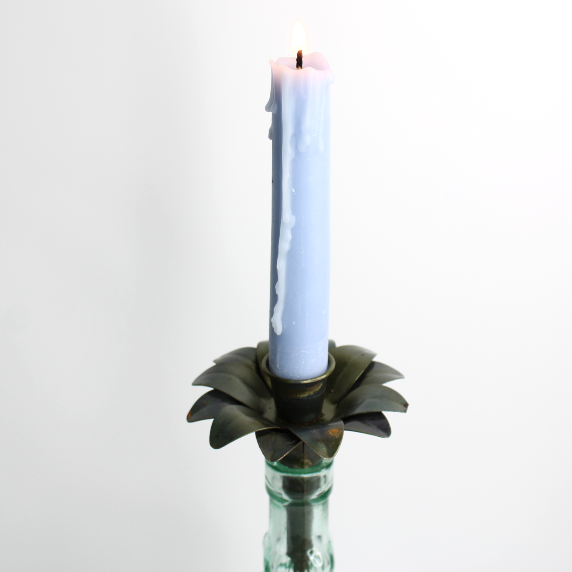 rustic candle holder for wine bottles with blue candle stick
