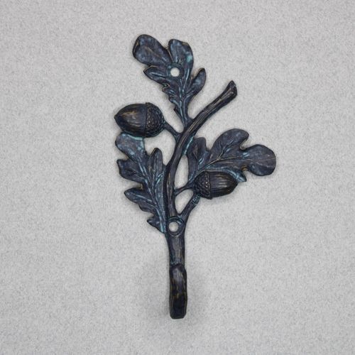 Front view of rustic bronze oak leaf and acorn wall hook with verdigris patina