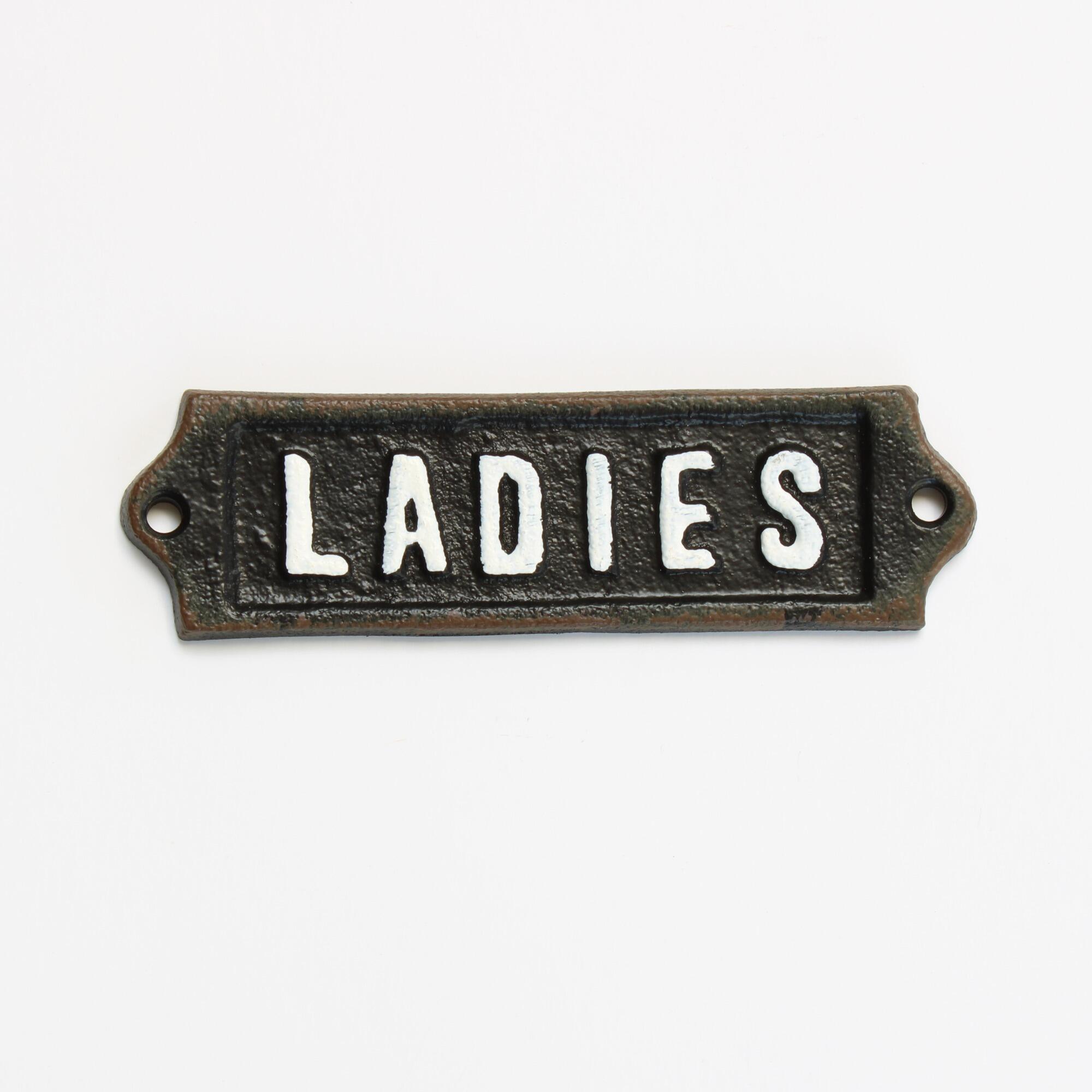 Cast iron ladies sign with a distressed paint finish