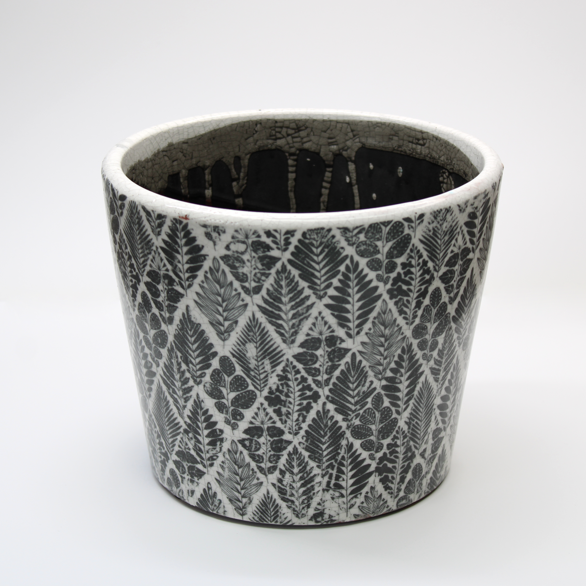 glazed plant pot with a black and white weathered pattern