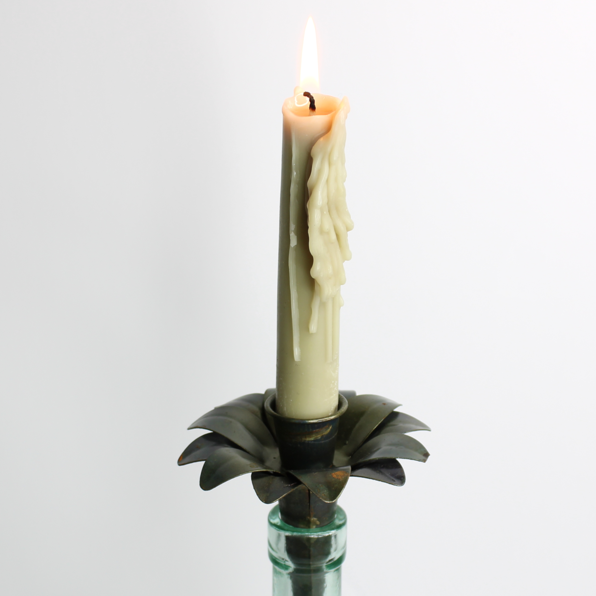rustic candle holder for wine bottles with green candle stick