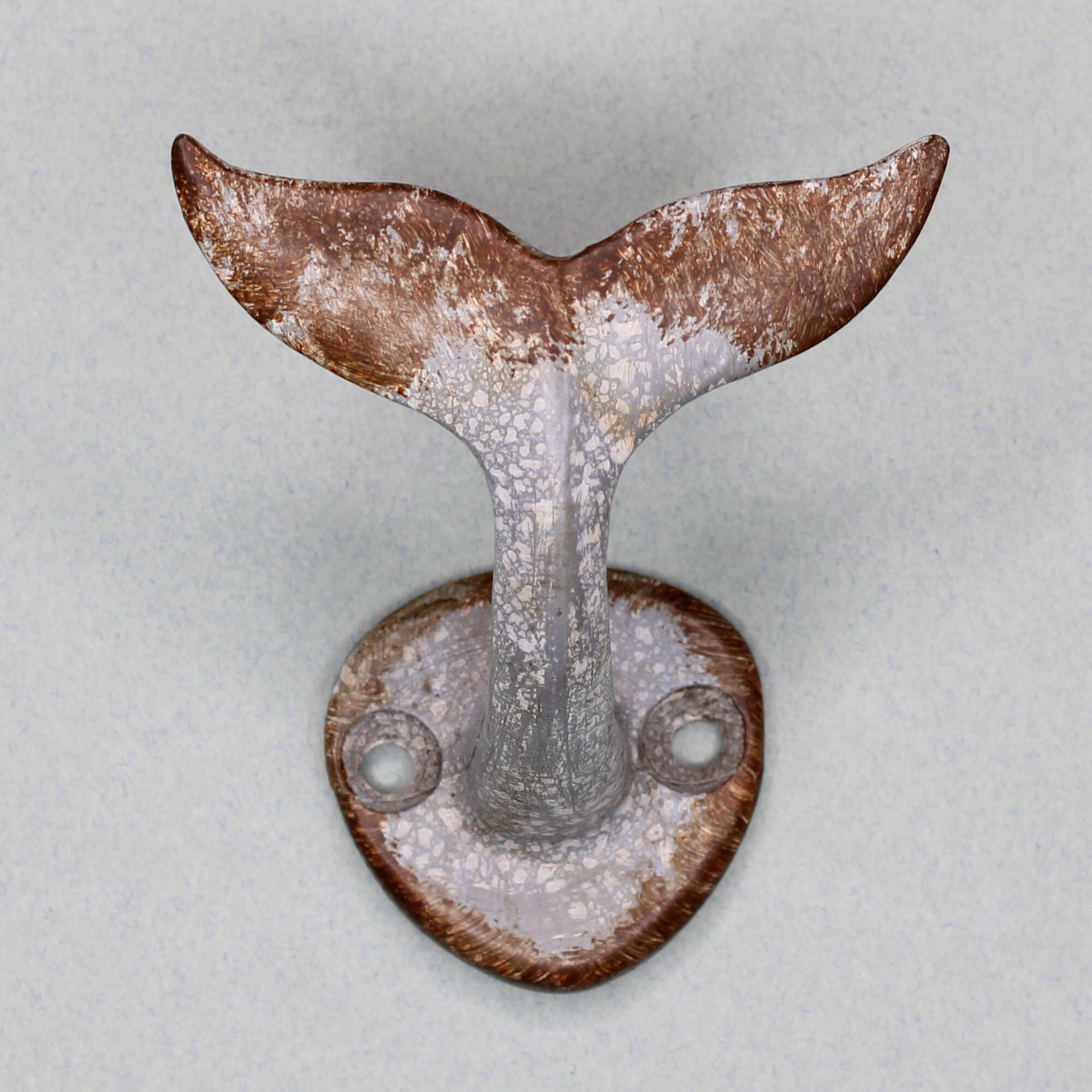 Whale tail wall hook perfect for beach house decor.