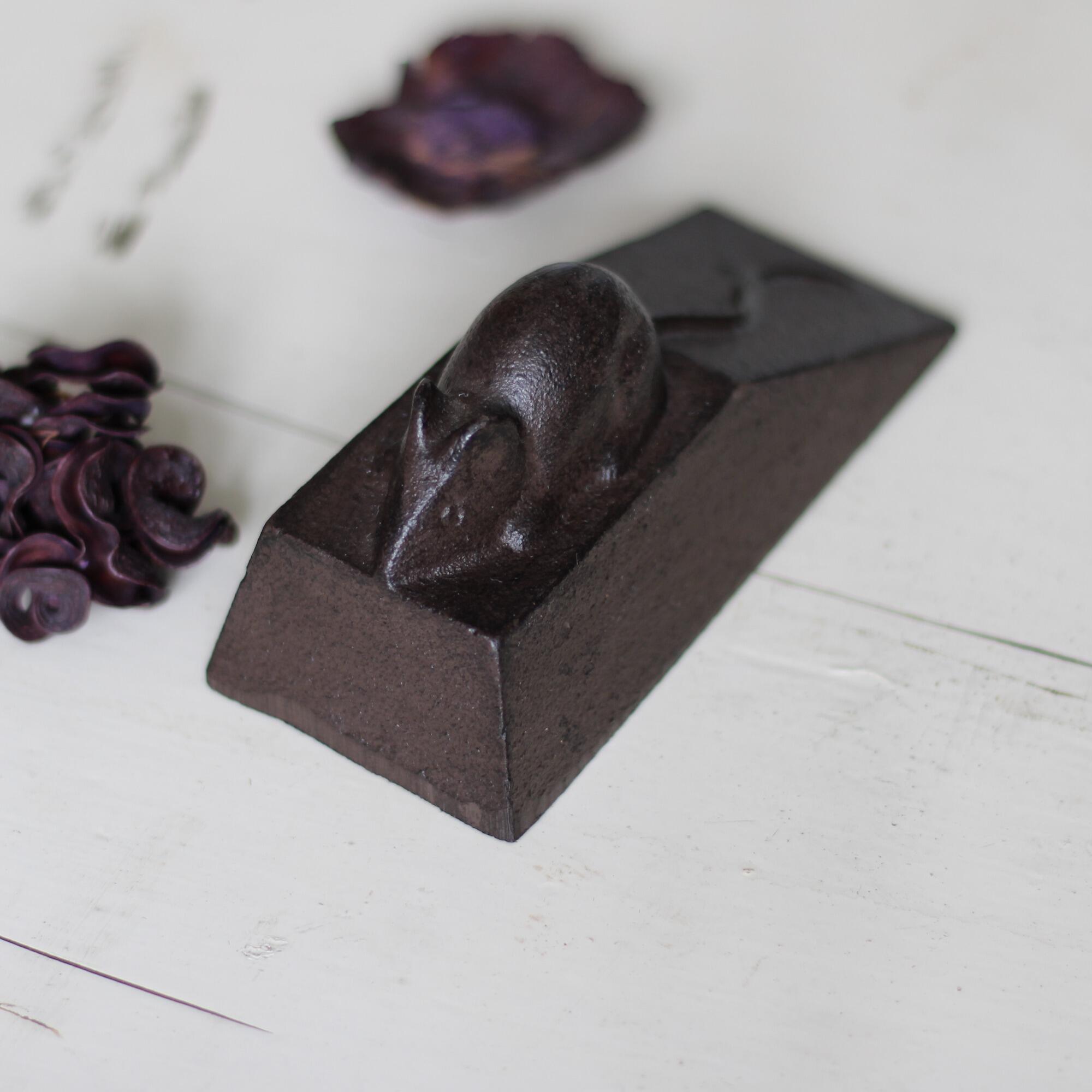 Metal door stop with mouse.