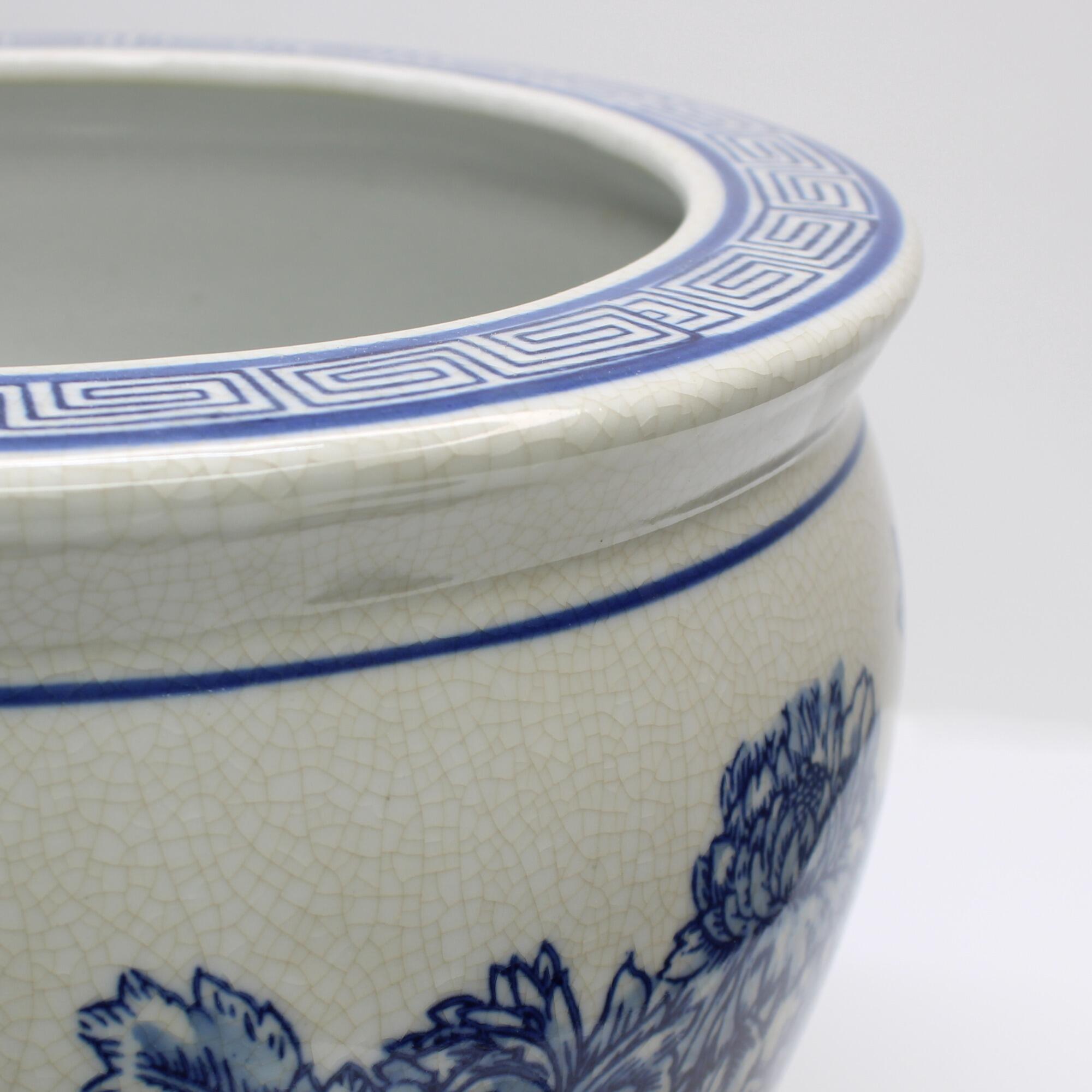 Blue floral plant pot closeup of the rims design.