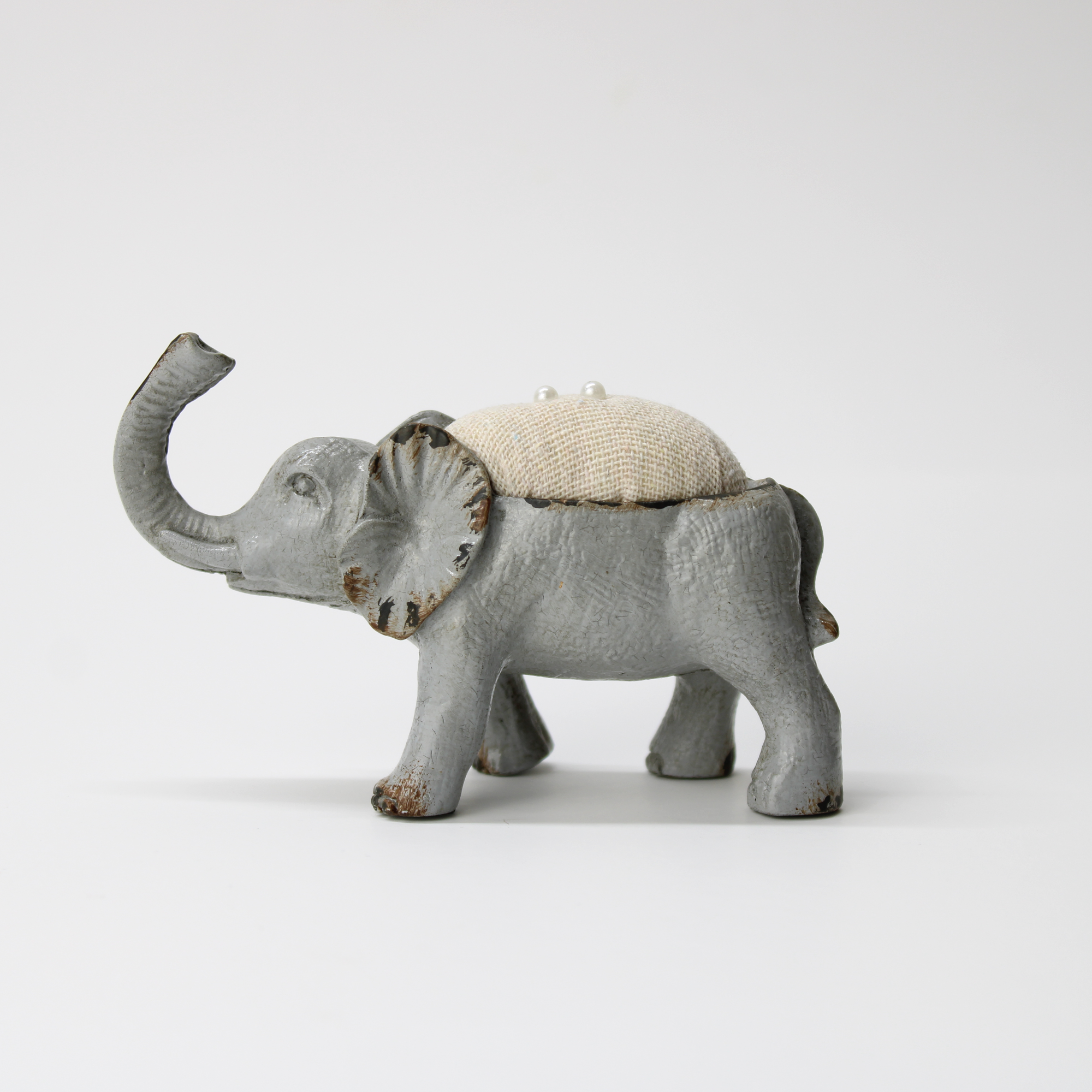 Decorative vintage-style elephant pincushion for sewing and crafting
