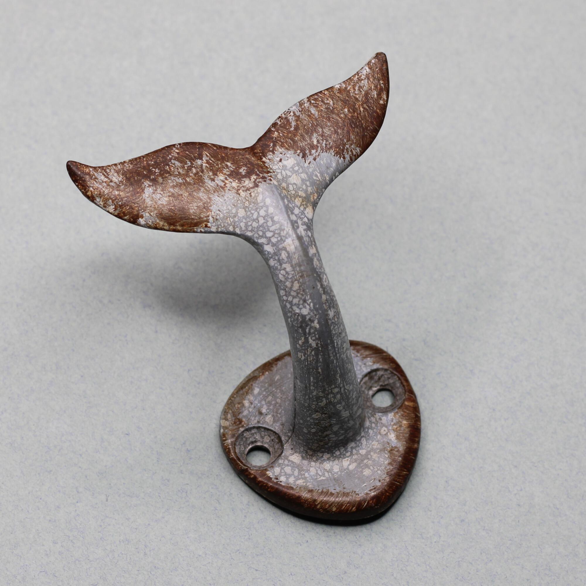 Whale tail wall hook for bathroom beach vibe.