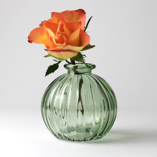 round ribbed green glass bud vase with orange rose