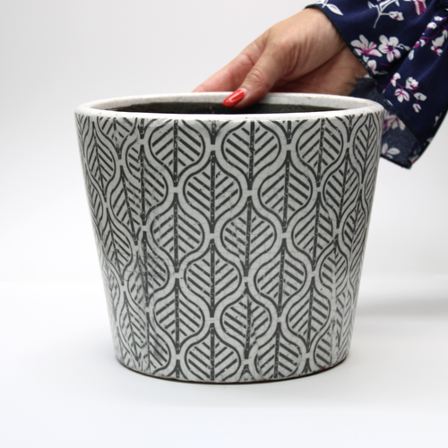 vintage style plant pot with a distressed black and white aged glaze finish