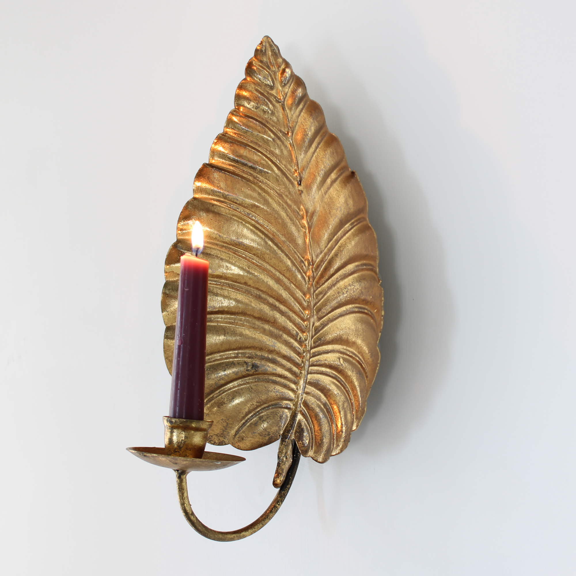 Gold candle sconce.