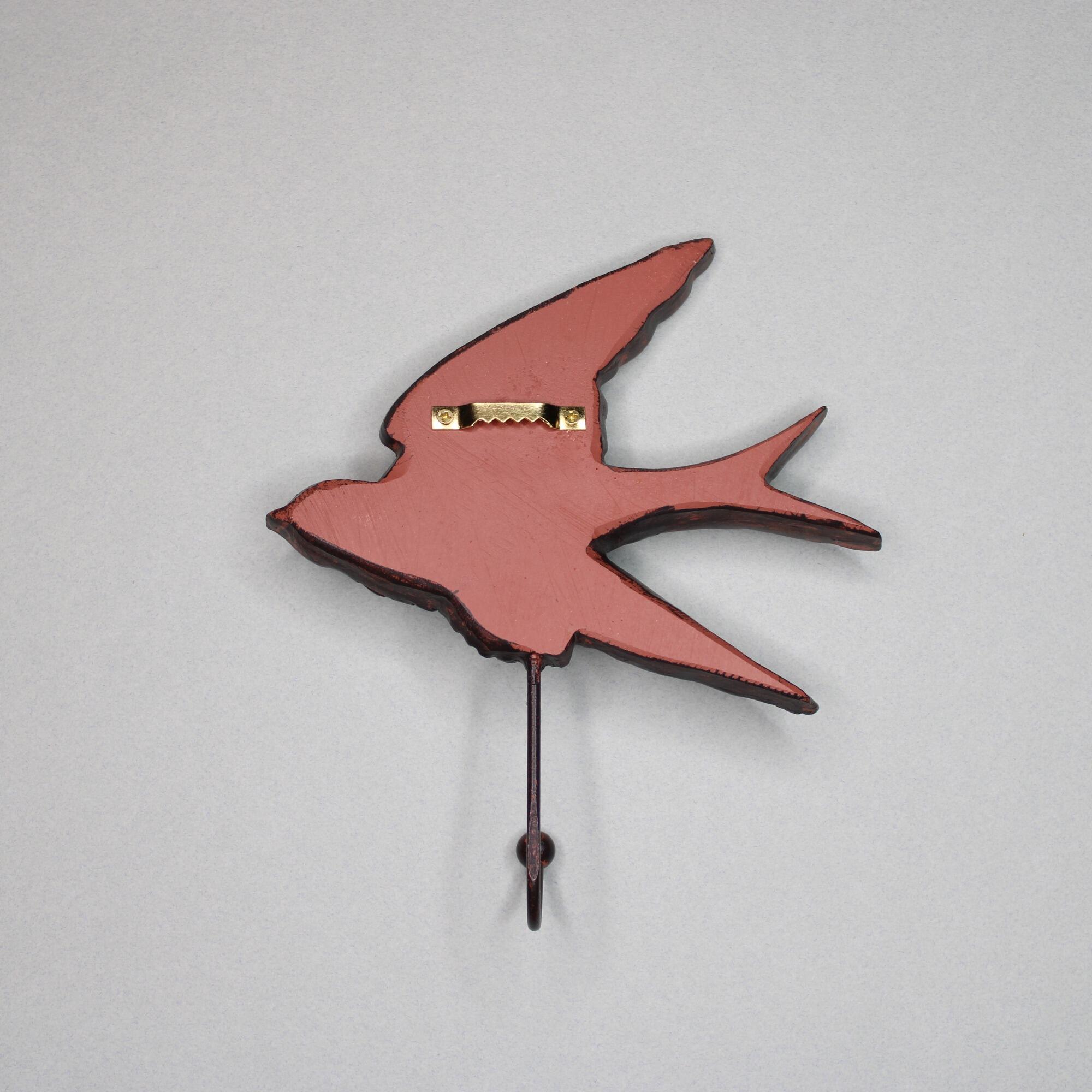 Back view of the swallow wall hook showing the flat mounting surface and the pre-installed gold sawtooth hanger.