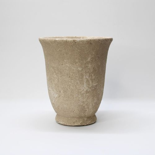Rustic Wabi-Sabi style concrete urn with a flared rim and weathered pockmarked finish for indoor plants.