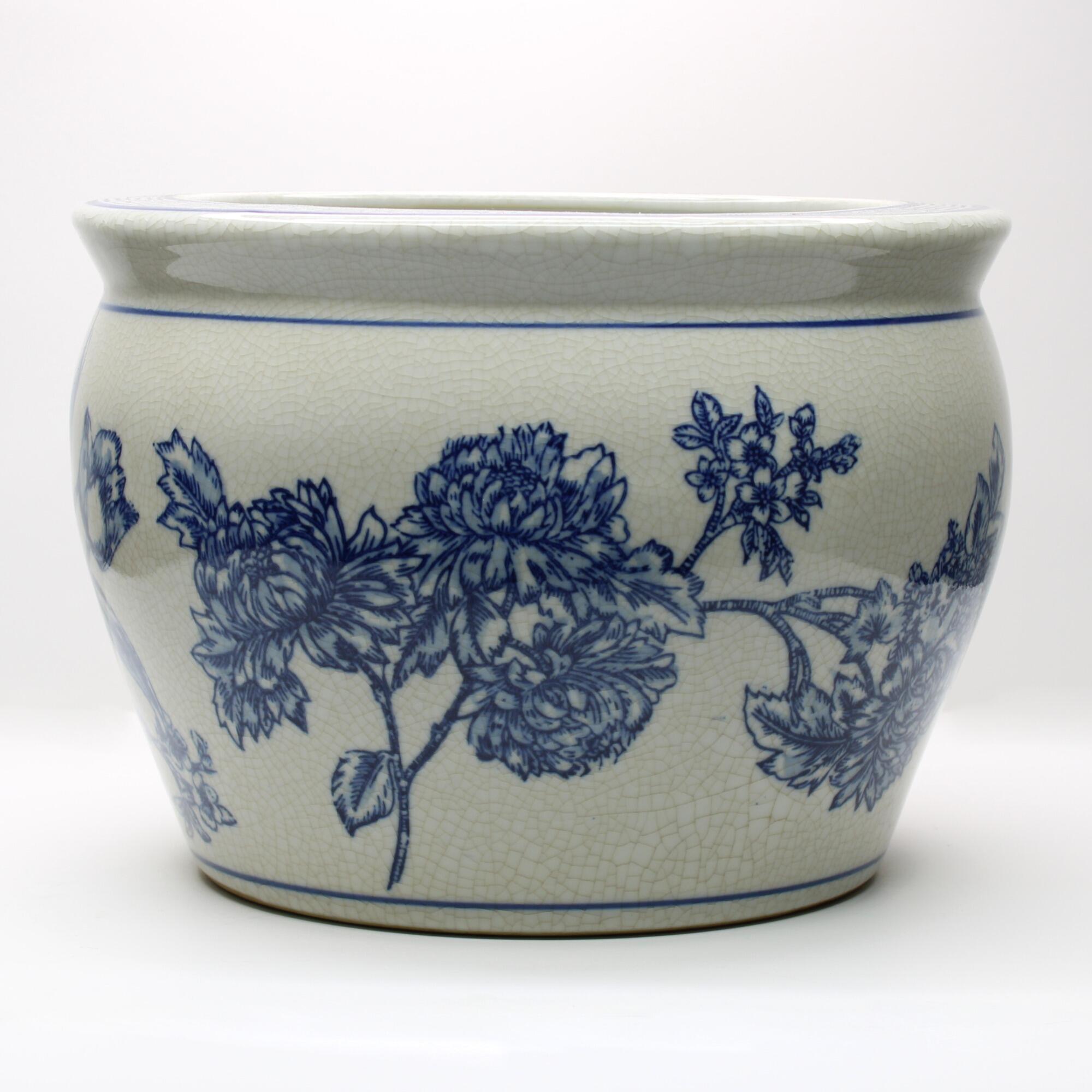 Traditional blue floral plant pot with a vintage-inspired crackled finish.