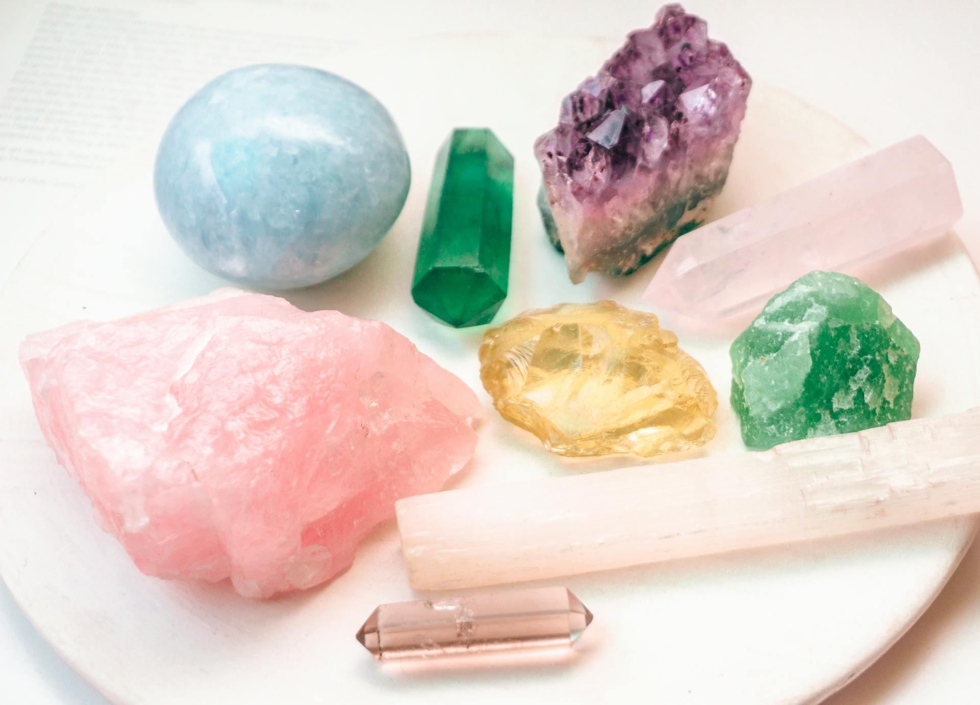 three crystals displayed on a sheet