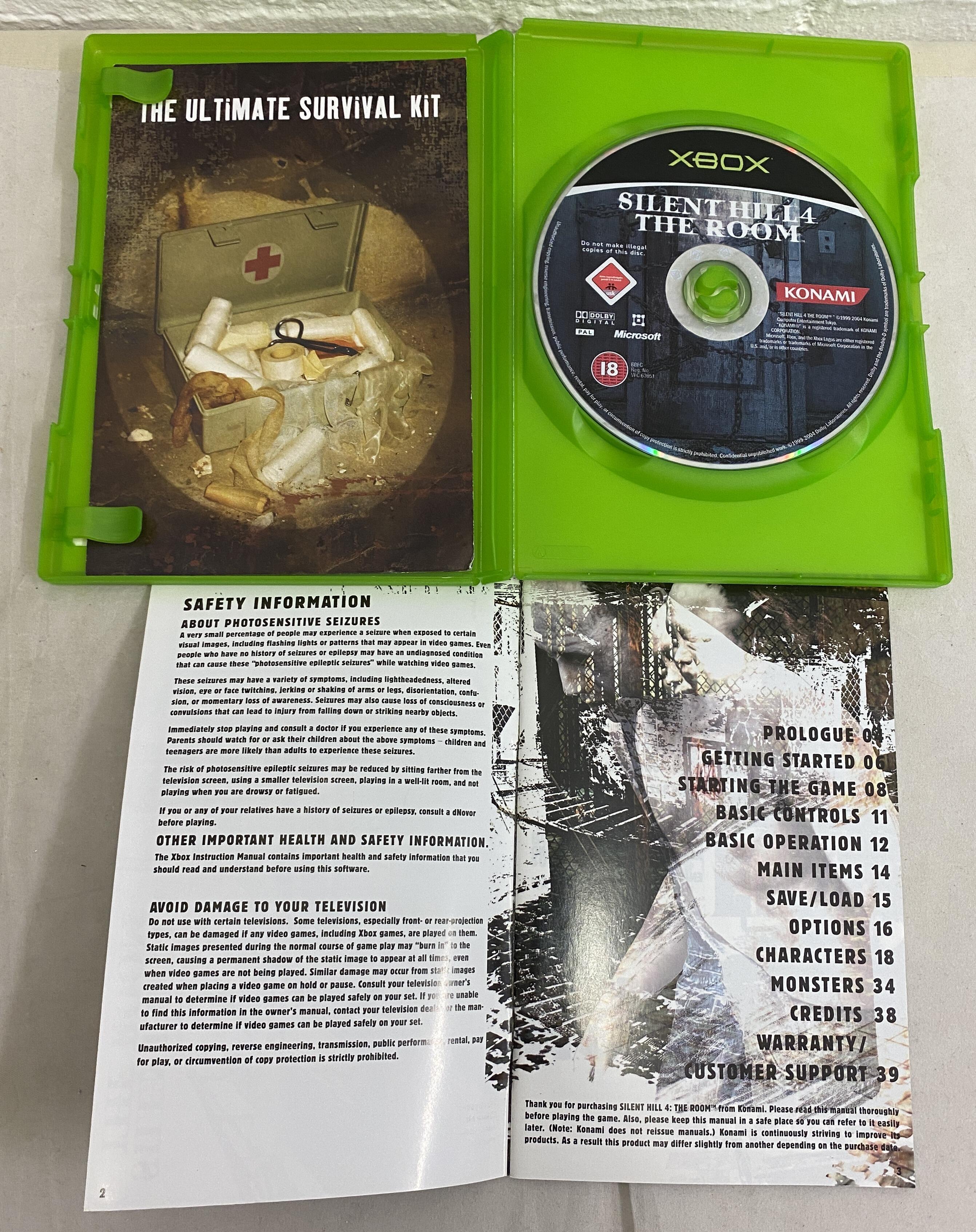Silent Hill 4 The Room Xbox case and manual front page opened showing condition