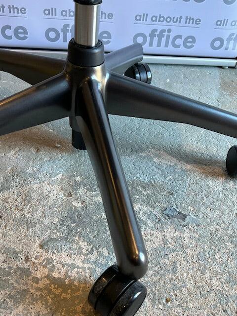 Close-up of the painted base and new castors on a refurbished Aeron Size B chair