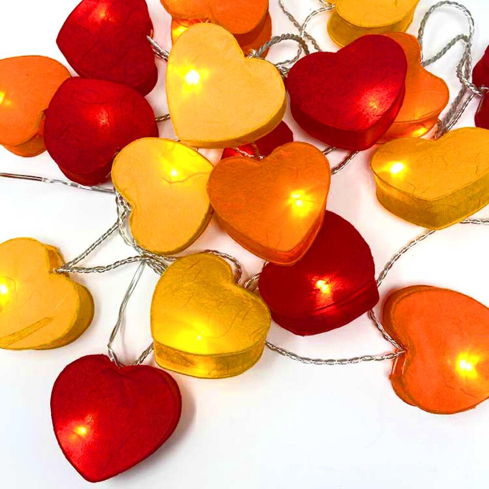 Handcrafted Radiant Heart 30 LED Fairy Lights in the Fire colourway. Hand-screened mulberry paper hearts with warm white LEDs. USB powered. UK 3-Pin USB plug included.