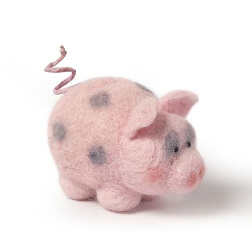 Finished Piggy the Pig felt animal, featuring a plump pink body with dark grey spots, a distinctive curly tail, and a sweet, rosy face from a DIY needle felting kit.