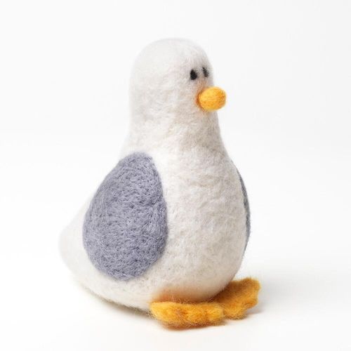 Finished Stanley the Seagull felt animal, showing his characteristic white body, grey wings, vibrant orange beak, and feet from a popular beginner needle felting kit.
