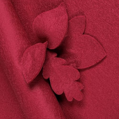 Cherry red wool-blend felt sheet featuring decorative die-cut leaf shapes to show texture and clean edges.