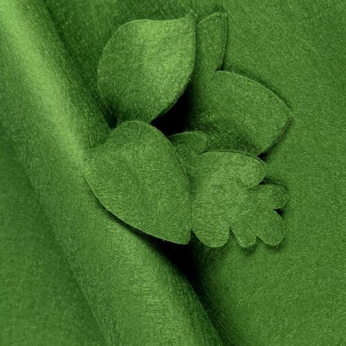 Rich Holly Green wool-blend felt sheet shown with decorative leaf cut-outs, highlighting its smooth matte finish and professional non-fray edges.