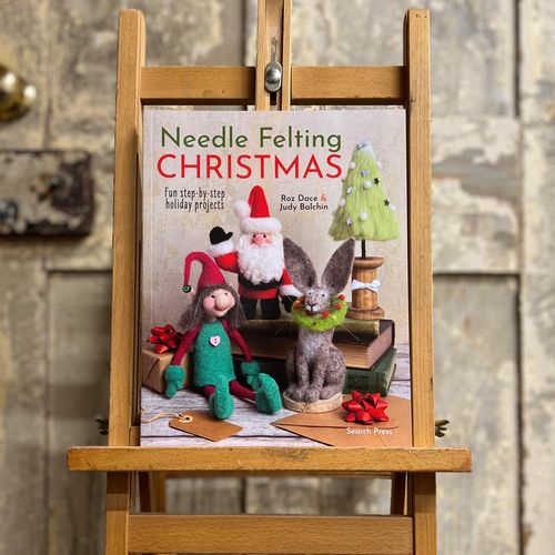 Front cover of Needle Felting Christmas by Roz Dace and Judy Balchin, a Woollie and Feltie recommended book for handmade holiday decorations.