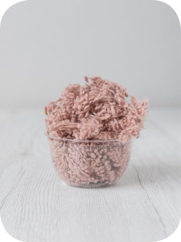 pink wool nepps in a 5g portion for adding texture to felting and spinning projects