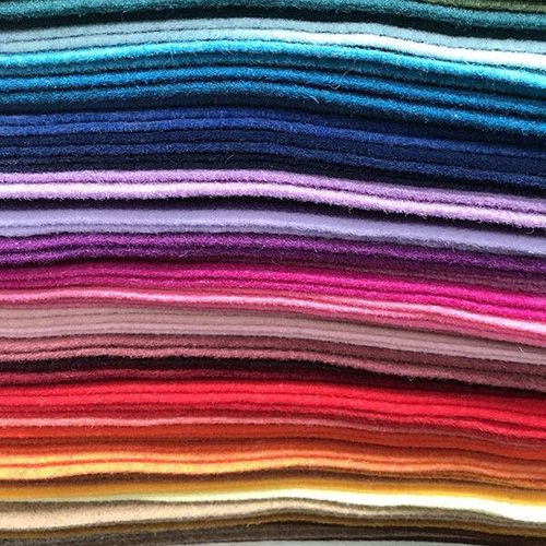 Close-up of premium 30% wool and 70% viscose handicraft felt in a variety of vibrant shades, highlighting the high-quality non-synthetic finish.