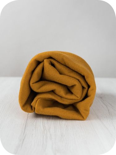 Premium Saffron merino wool prefelt in a rich mustard-gold shade, approx A4 size, imported from the DHG dyehouse in Italy.