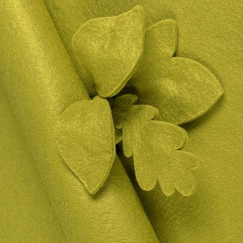Bright Meadow Green wool-blend felt sheet shown with decorative leaf cut-outs, highlighting its soft matte texture and non-fray edges.
