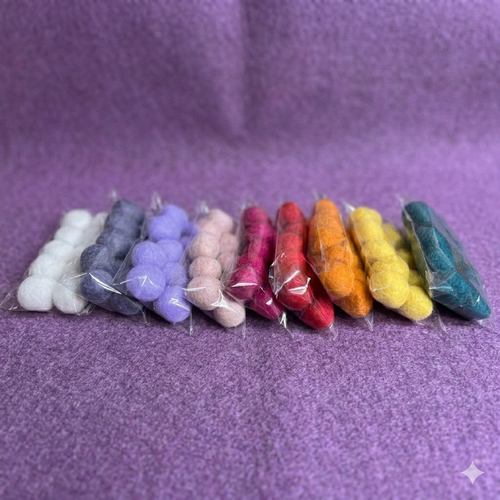 Assorted DHG Italy wool felt ball packs for garlands, jewellry, and needle felting, featuring an artisan color palette.