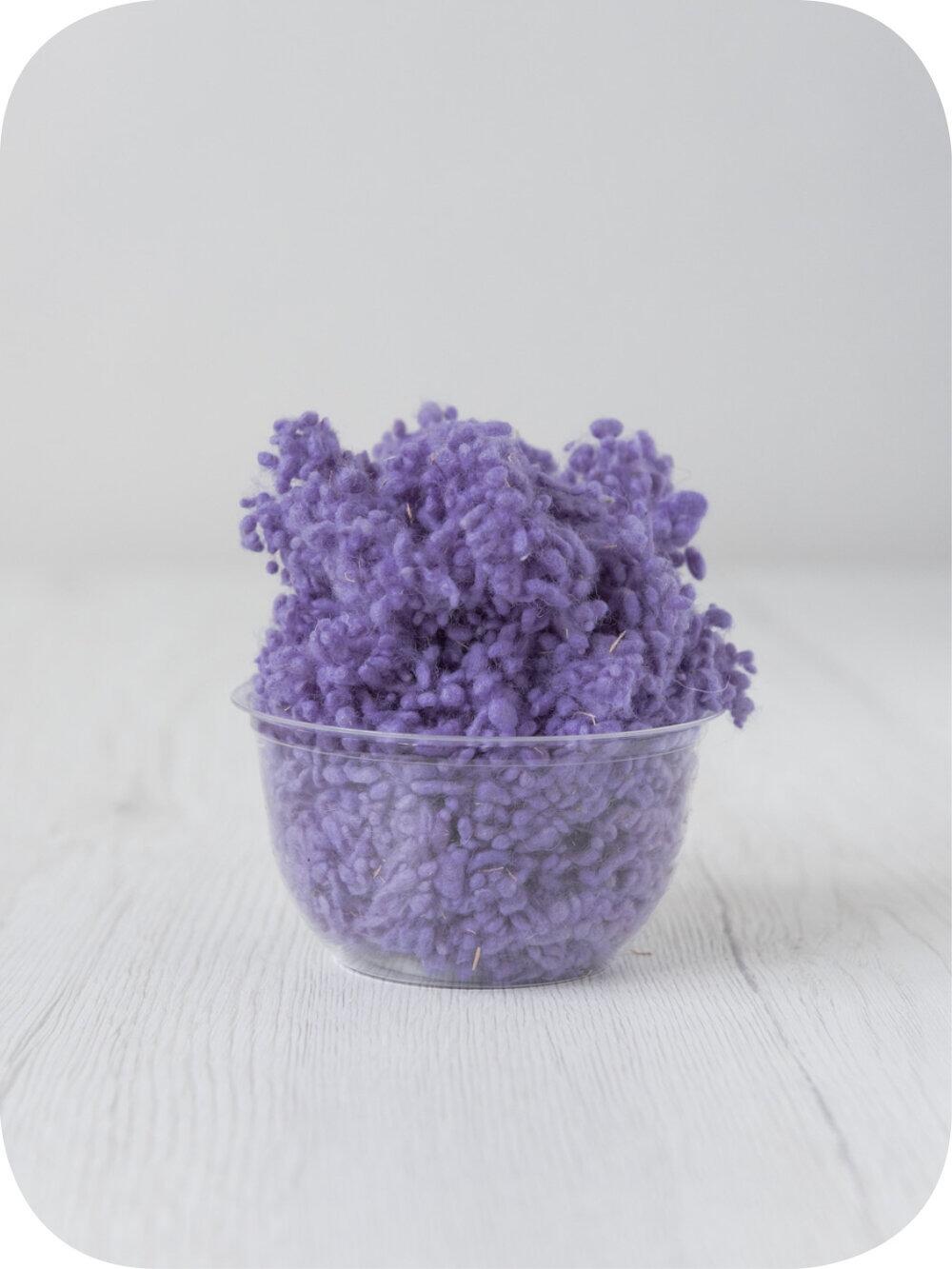 lavender wool nepps in a 5g portion for adding texture to felting and spinning projects