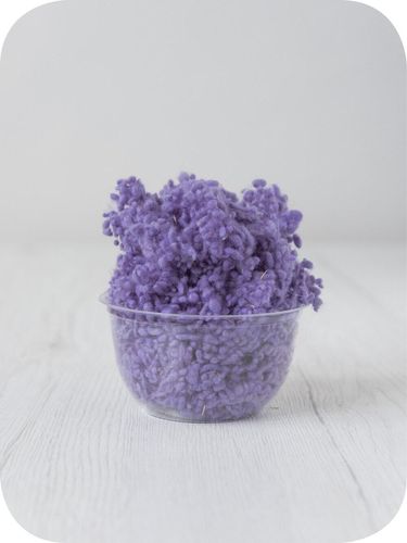 lavender wool nepps in a 5g portion for adding texture to felting and spinning projects
