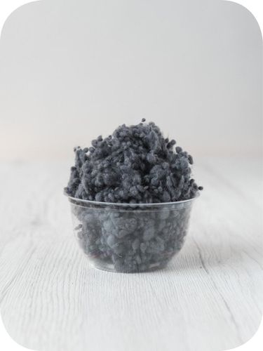 dark grey wool nepps in a 5g portion for adding texture to felting and spinning projects