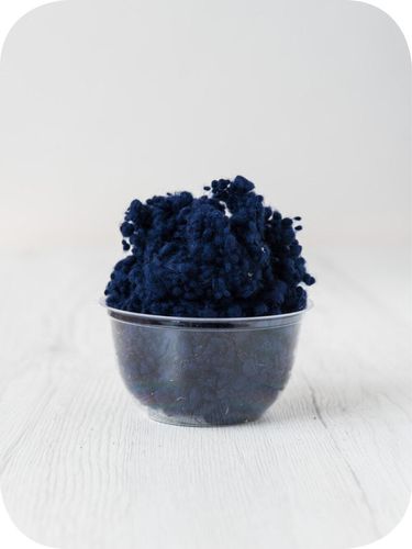 navy blue wool nepps in a 5g portion for adding texture to felting and spinning projects