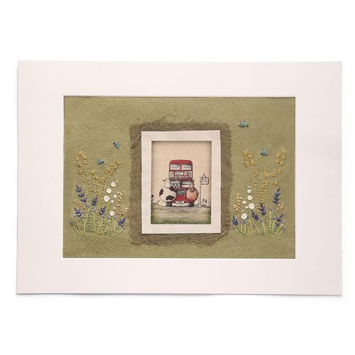 Completed embroidery project featuring a red London Bus with a cow and horse, layered onto olive green felt with embroidered dragonflies and meadow flowers.
