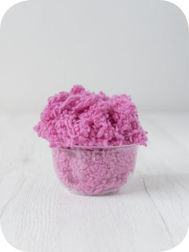 pink wool nepps in a 5g portion for adding texture to felting and spinning projects