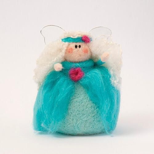 A 3D needle-felted fairy named Guinevere wearing a vibrant turquoise gown with white curly hair and a golden-yellow flower.