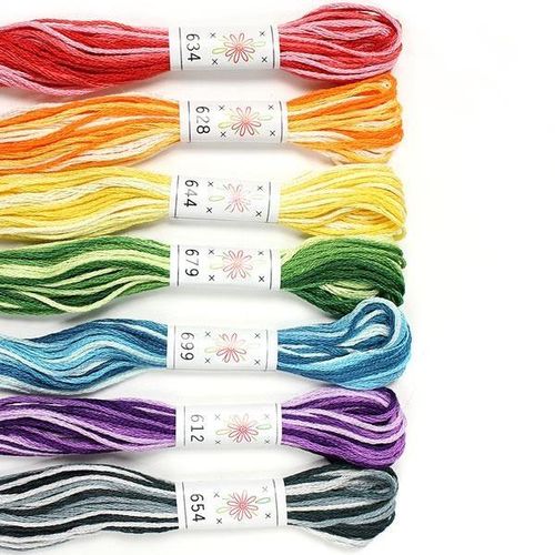 A collection of seven variegated Sublime "Taffy Pull" embroidery floss skeins.