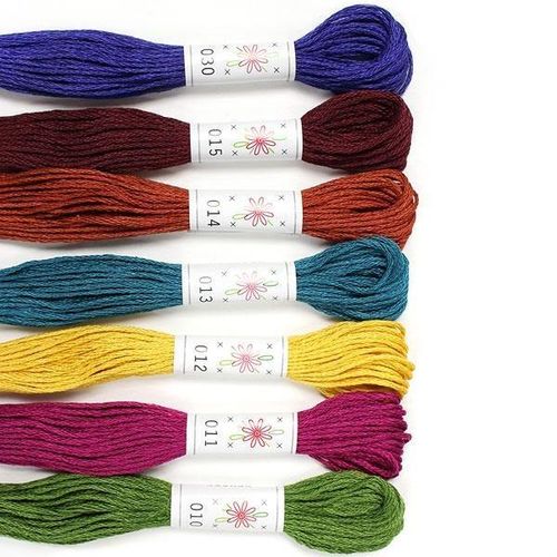 A collection of seven rich Sublime "Laurel Canyon" embroidery floss skeins in earthy, bohemian shades.
