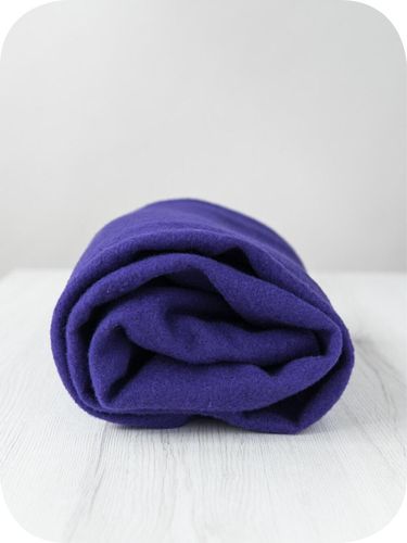 A roll of deep, regal Florence purple extra fine merino wool prefelt.