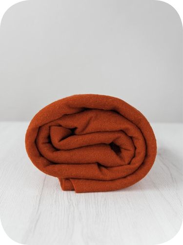 Premium Rust merino wool prefelt in a deep earthy orange shade, approx A4 size, imported from the DHG dyehouse in Italy.