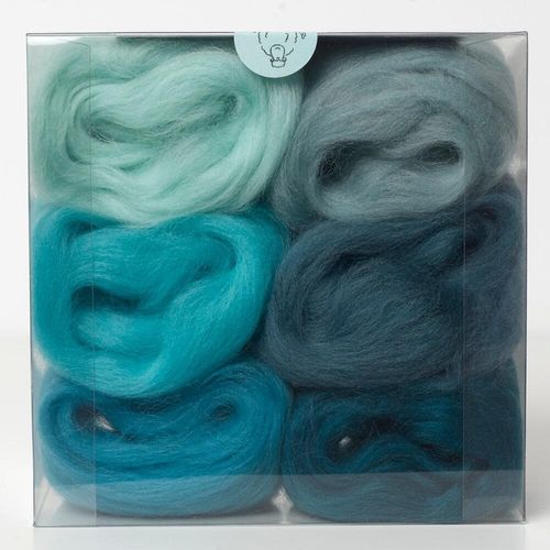 A curated marine blues merino wool shade pack containing six 5g portions of non-mulesed wool tops.