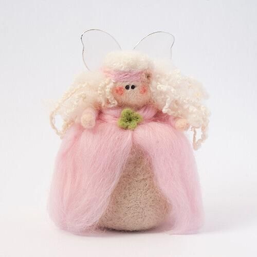 A 3D needle-felted fairy in a soft pink gown with long curly white hair, a green flower accent, and delicate wings.