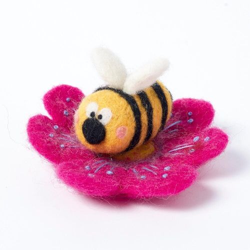Finished Albert Bumble project showing a striped 3D bee resting on a flat-felted fuchsia flower base that has been intricately embroidered with blue thread.