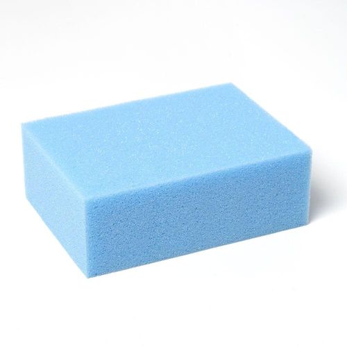 A 2-inch thick blue foam felting block on a white background, used as a protective base for needle felting projects.